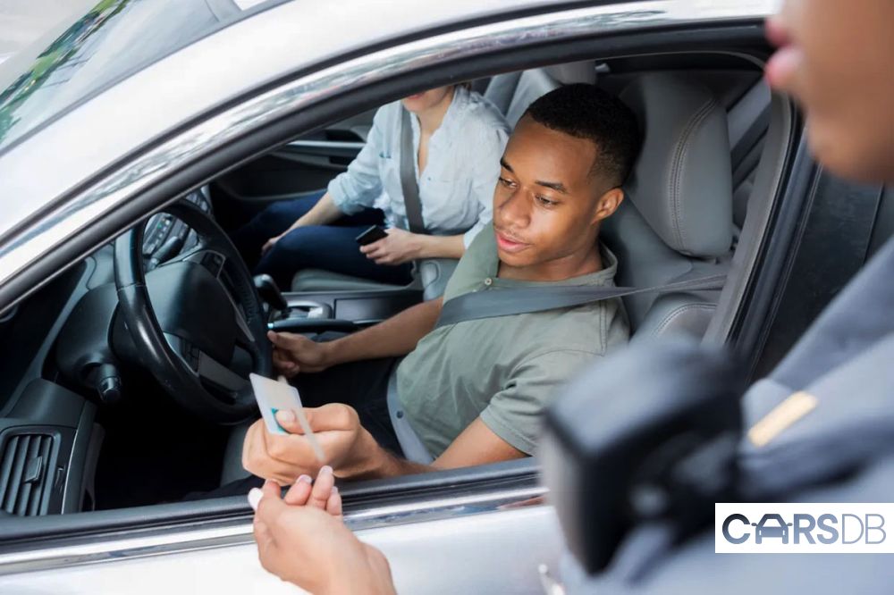 young-man-pulled-traffic-violation-1004343147.jpg
