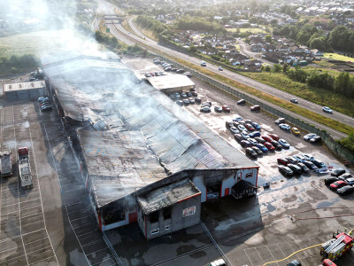 Nation’s largest car supermarket with ‘hundreds’ of motors inside ravaged by fire that tore through it ‘in seconds’