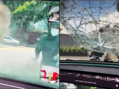 Woman Suddenly Throws Rock At Tesla’s Windscreen, Caught On Camera